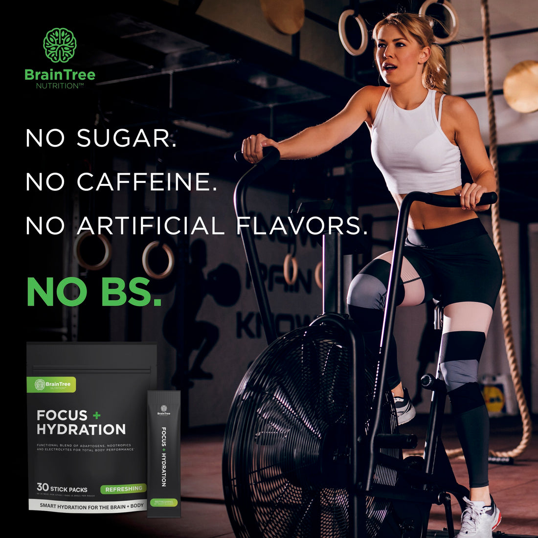 Woman training on assault bike using refreshing hydration and nootropic drink for clean energy.