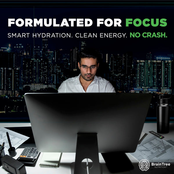 Professional working late supported by watermelon nootropic hydration drink for mental clarity and clean energy.